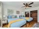 This bedroom features two beds, a ceiling fan, and a large closet at 1145 53Rd N Ave, St Petersburg, FL 33703