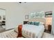 Cozy bedroom with a neutral color palette, plush rug, and natural light, creating a relaxing atmosphere at 1145 53Rd N Ave, St Petersburg, FL 33703