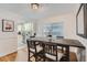 This dining room features an open view into the adjacent modern kitchen at 1145 53Rd N Ave, St Petersburg, FL 33703