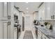 This updated kitchen offers granite counters, white cabinets, and stainless steel appliances at 1145 53Rd N Ave, St Petersburg, FL 33703