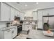 The kitchen boasts stainless steel appliances, granite counters and gray cabinets at 1145 53Rd N Ave, St Petersburg, FL 33703