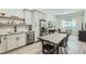 Contemporary open-concept kitchen with stainless steel appliances and a dining table at 1145 53Rd N Ave, St Petersburg, FL 33703