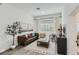Comfortable living room featuring neutral decor, a sofa, and a large window at 1145 53Rd N Ave, St Petersburg, FL 33703