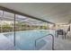 Inviting screened-in pool area with a seating area under a covered patio at 1145 53Rd N Ave, St Petersburg, FL 33703