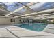 Backyard screened pool featuring a covered patio with a seating and lounging area at 1145 53Rd N Ave, St Petersburg, FL 33703