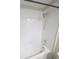 Bathtub shower combo with white tile and brushed nickel shower head and faucet at 11524 Sage Canyon Dr, Riverview, FL 33578