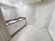 Bathroom featuring double sink vanity, neutral walls, tiled floors, and shower at 11524 Sage Canyon Dr, Riverview, FL 33578