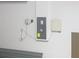 View of the home's modern electrical panel and water controller, ensuring efficient operation at 11524 Sage Canyon Dr, Riverview, FL 33578