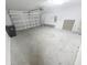 View of the home's expansive two-car garage, featuring high ceilings and ample storage capabilities at 11524 Sage Canyon Dr, Riverview, FL 33578