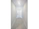 Hallway features tile flooring leading to a white front door at 11524 Sage Canyon Dr, Riverview, FL 33578