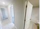 Hallway showing bath and bedroom entrances at 11524 Sage Canyon Dr, Riverview, FL 33578