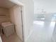 Laundry room with white tiled floors, washer, and spacious layout at 11524 Sage Canyon Dr, Riverview, FL 33578