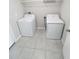 Functional laundry room equipped with modern washer and dryer units at 11524 Sage Canyon Dr, Riverview, FL 33578