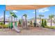 Community playground, featuring multiple slides, climbing structures, and a shaded play area for children at 11524 Sage Canyon Dr, Riverview, FL 33578