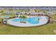 A refreshing community pool with palm trees and ample deck space for lounging and relaxing at 11524 Sage Canyon Dr, Riverview, FL 33578