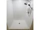 Clean shower stall with white tiled walls and modern shower heads at 11524 Sage Canyon Dr, Riverview, FL 33578