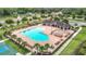 Aerial view of community pool, pavilion, and tennis court showcasing the wonderful amenities at 12687 Retreat Pl, Spring Hill, FL 34610