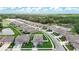 Aerial view of a well-maintained community surrounded by serene ponds and lush greenery at 12687 Retreat Pl, Spring Hill, FL 34610