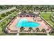 Aerial view of community amenities with a large pool, pavilion, and comfortable lounge chairs at 12687 Retreat Pl, Spring Hill, FL 34610