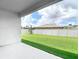 Private backyard with well-maintained lawn and white fence, perfect for recreation and relaxation at 12687 Retreat Pl, Spring Hill, FL 34610