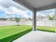 Spacious backyard with green lawn and white fence, offering privacy and outdoor enjoyment at 12687 Retreat Pl, Spring Hill, FL 34610