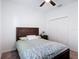 Bright bedroom featuring a closet, ceiling fan, and nightstand, offering style and functionality at 12687 Retreat Pl, Spring Hill, FL 34610