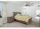 Inviting bedroom with a stylish bed, bedside table, and soft lighting, creating a cozy atmosphere at 12687 Retreat Pl, Spring Hill, FL 34610