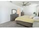 Comfortable bedroom featuring a large bed, dresser, and neutral colors, perfect for relaxation at 12687 Retreat Pl, Spring Hill, FL 34610