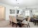 Dining area with a modern table, chairs, and open concept design at 12687 Retreat Pl, Spring Hill, FL 34610