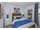Comfortable bedroom featuring neutral tones, a wooden bed frame, and ample natural light at 13548 Tropical Breeze Way, Hudson, FL 34669