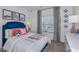 Cozy bedroom with a comfortable bed, stylish decor, and plenty of natural light at 13548 Tropical Breeze Way, Hudson, FL 34669