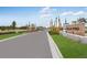 View of Palm Wind community entrance with sign, road, and landscaped areas at 13548 Tropical Breeze Way, Hudson, FL 34669