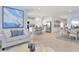 Spacious open-concept living area with kitchen, dining, and comfortable seating, perfect for modern living at 13548 Tropical Breeze Way, Hudson, FL 34669