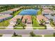 Aerial view of lakeside homes in a beautifully landscaped and well-planned neighborhood at 15525 Corona Del Mar Dr, Wimauma, FL 33598