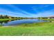 A vast backyard leads to a peaceful lake, enhancing the home's serene and picturesque setting at 15525 Corona Del Mar Dr, Wimauma, FL 33598
