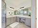 Bathroom with a glass shower, vanity, lighting, and neutral decor at 15525 Corona Del Mar Dr, Wimauma, FL 33598