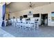 Outdoor bistro features a long bar with seating and mounted TV's at 15525 Corona Del Mar Dr, Wimauma, FL 33598