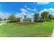 Beautiful community entrance sign surrounded by professionally maintained landscaping at 15525 Corona Del Mar Dr, Wimauma, FL 33598