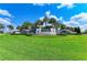 Beautiful landscaping at community entrance with waterfall feature and signage at 15525 Corona Del Mar Dr, Wimauma, FL 33598