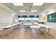 Bright conference room featuring large tables, ample seating, and modern presentation equipment at 15525 Corona Del Mar Dr, Wimauma, FL 33598