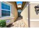 Covered entryway featuring tiled flooring and a secure, modern front door at 15525 Corona Del Mar Dr, Wimauma, FL 33598
