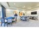 The game room features card tables with seating and a flat screen TV at 15525 Corona Del Mar Dr, Wimauma, FL 33598