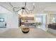 Modern kitchen with stainless steel appliances and a view into the dining area at 15525 Corona Del Mar Dr, Wimauma, FL 33598