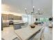 Open-concept living space featuring a dining area, kitchen, and living room at 15525 Corona Del Mar Dr, Wimauma, FL 33598