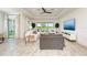 Bright living room showcasing open floor plan, water views, and stylish decor at 15525 Corona Del Mar Dr, Wimauma, FL 33598