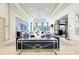 Light-filled lobby featuring elegant decor, chandeliers, and comfortable seating areas at 15525 Corona Del Mar Dr, Wimauma, FL 33598