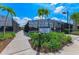 Sign for Racquet Club, Pavilion & Restrooms with walking path leading to tennis facilities at 15525 Corona Del Mar Dr, Wimauma, FL 33598