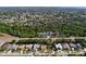 A high altitude aerial shot shows a residential neighborhood with mature trees at 1599 Mcauliffe Ln, Palm Harbor, FL 34683