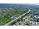 A high altitude aerial shot shows a residential neighborhood near the water at 1599 Mcauliffe Ln, Palm Harbor, FL 34683
