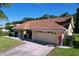 Well-maintained single-story house with a spacious two car garage at 1599 Mcauliffe Ln, Palm Harbor, FL 34683
